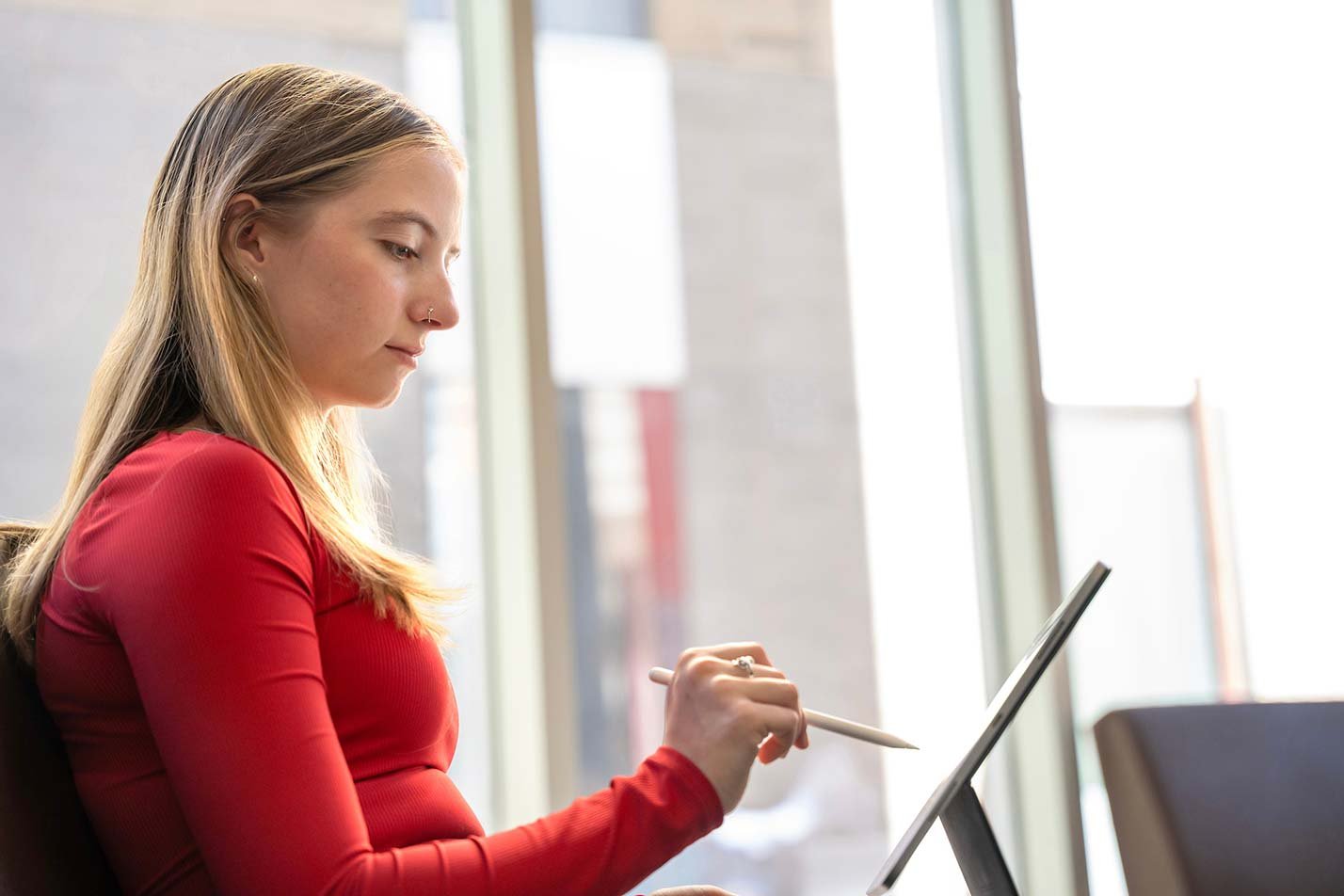 A student works on a tablet, illustrating hands-on learning in ASU's Accountancy certificate program.