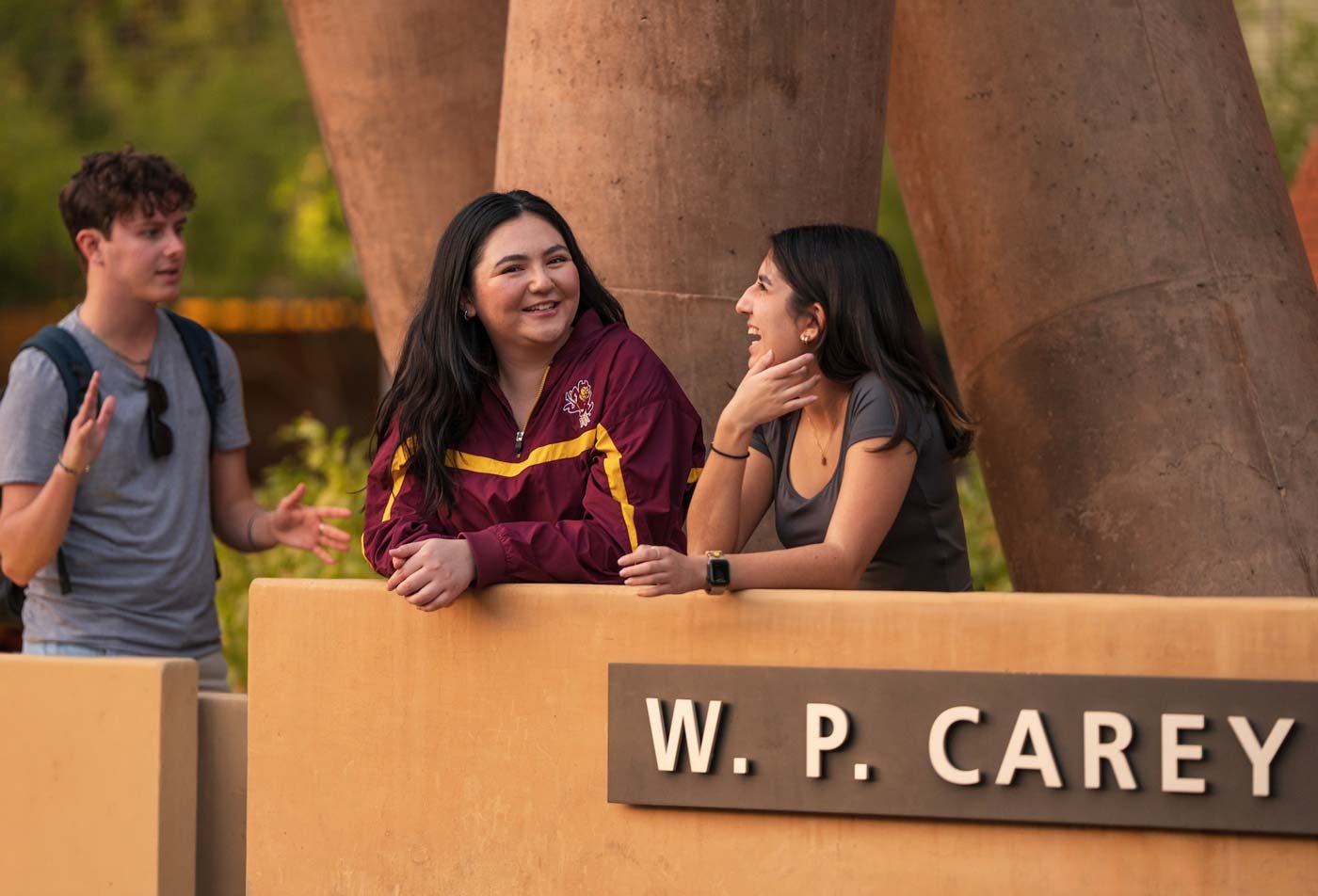 Students engage in discussion outside campus, showcasing the valuable connections made through ASU's Applied Business Data Analytics certificate program.