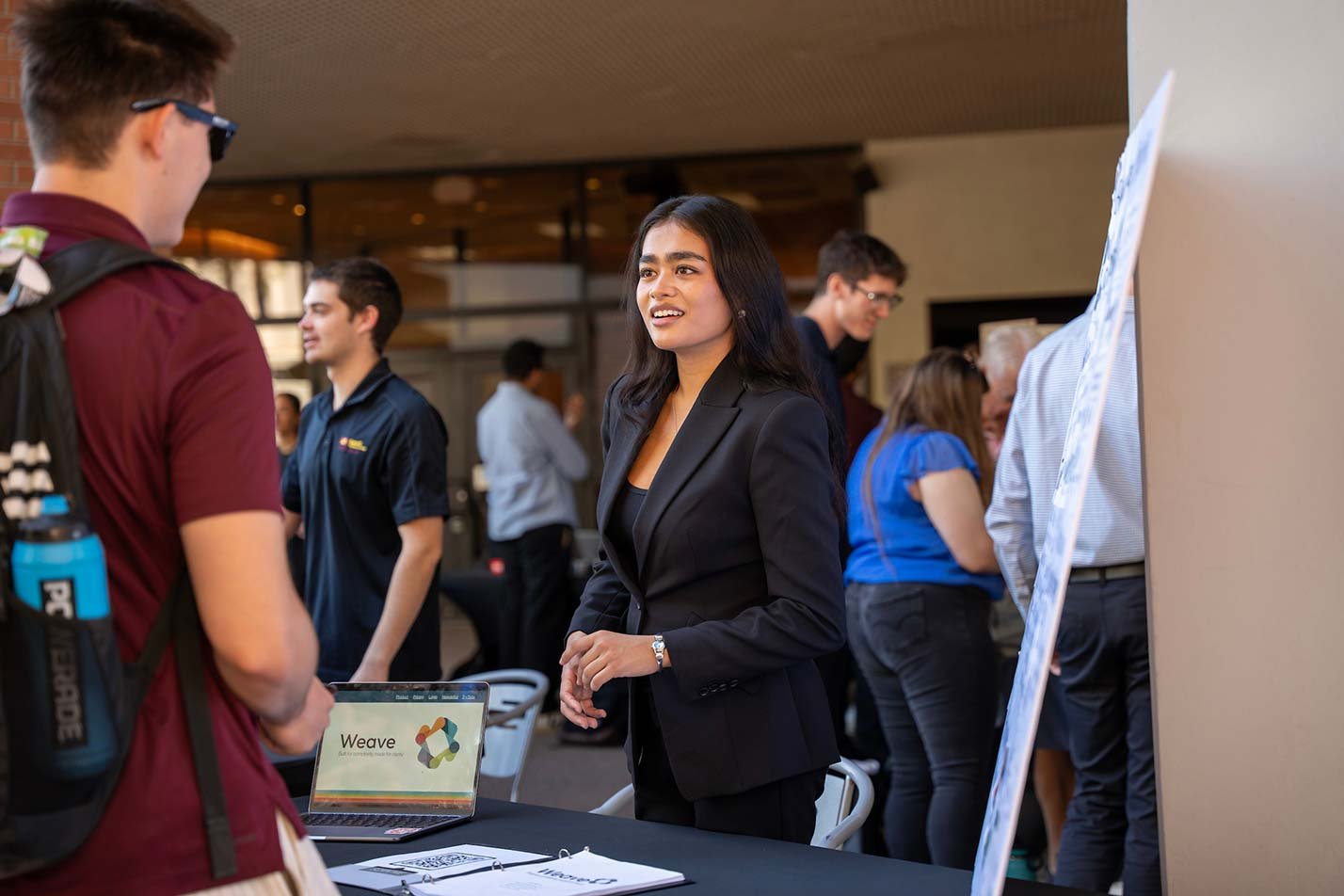 At a promotional event, discussion demonstrates the networking skills explored in ASU's Business Entrepreneurship degree.