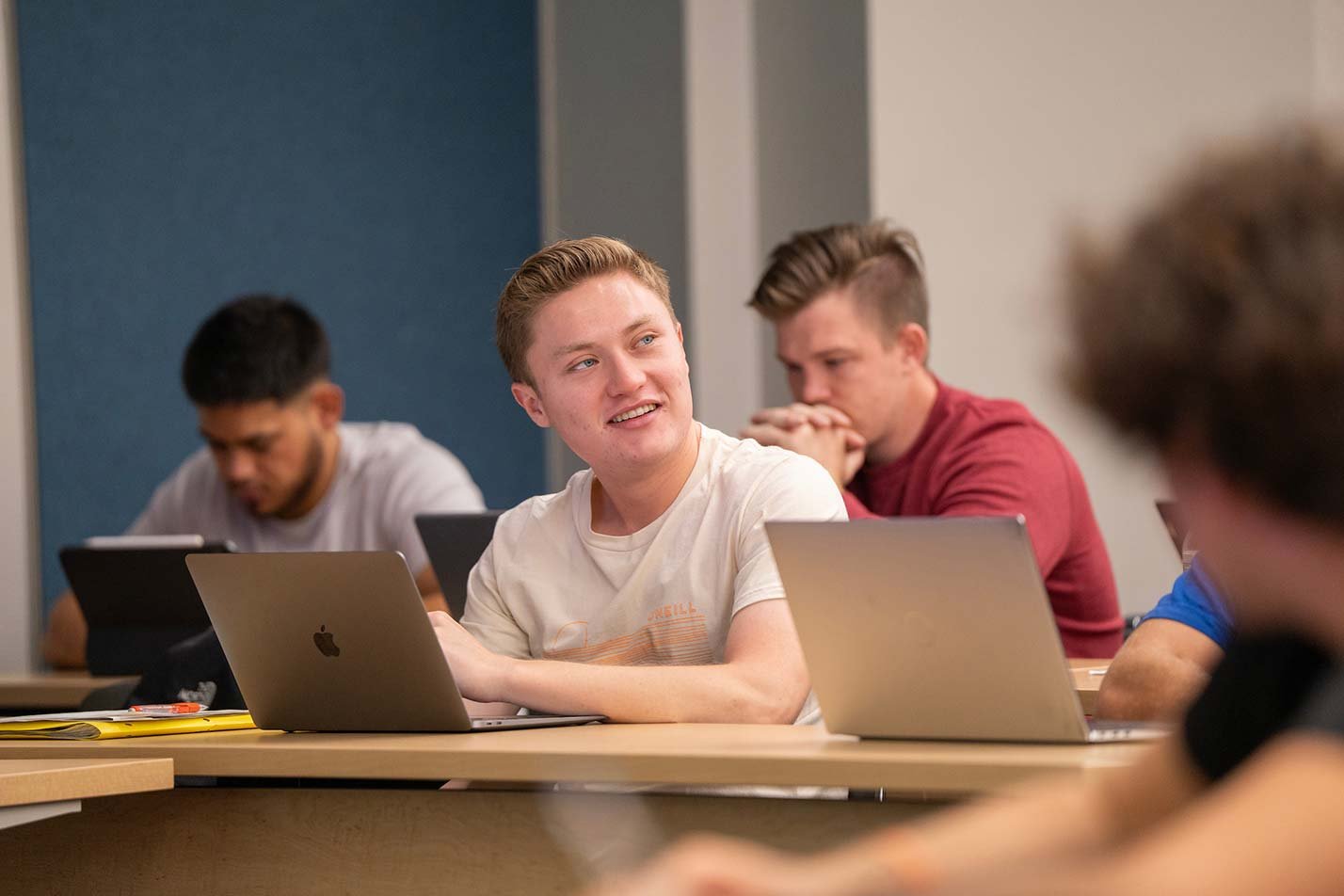 Engaged learners join a classroom discussion, representing collaborative learning in ASU's BA in Business (Applied Supply Chains) degree.