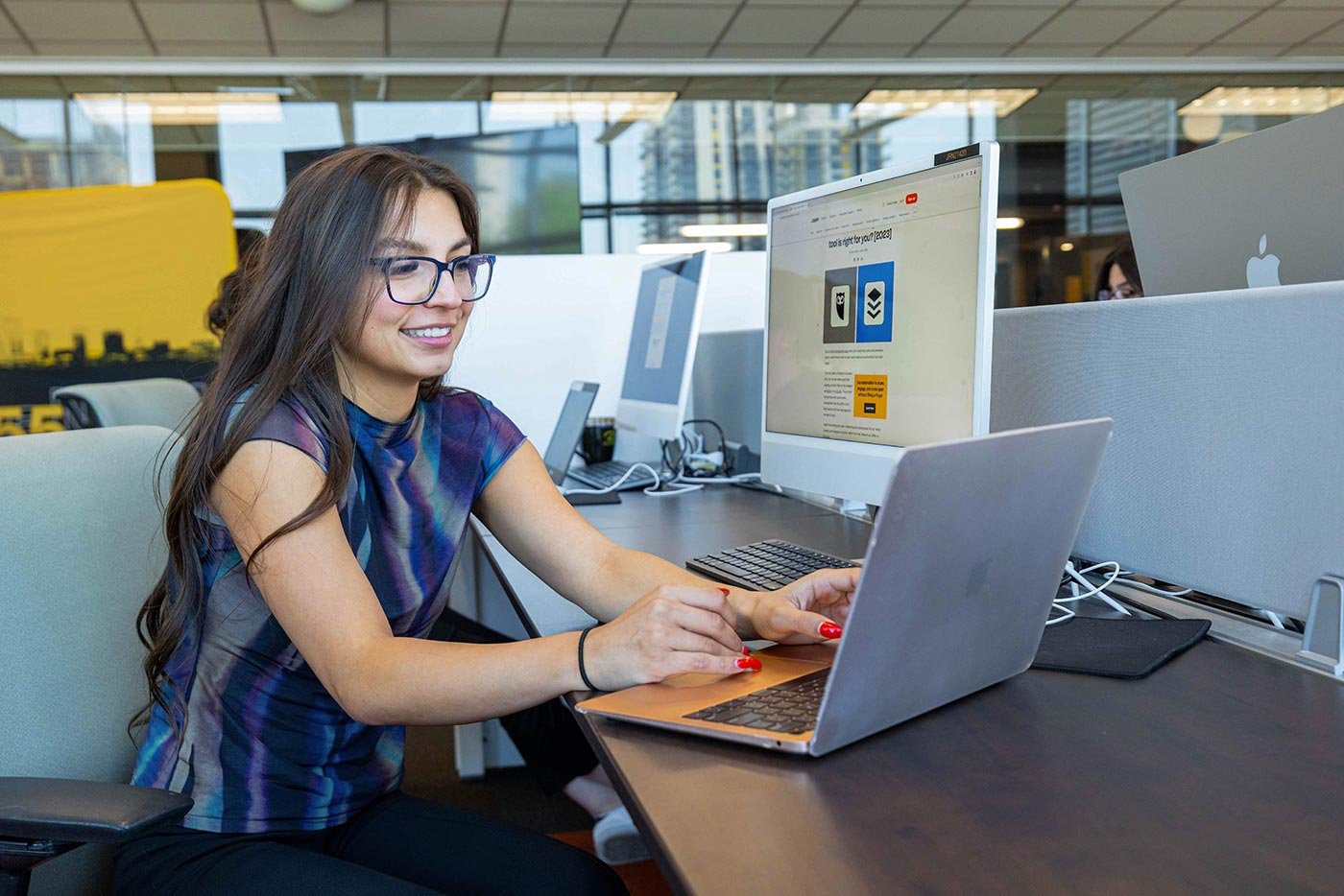 A student works on digital marketing content on a computer, illustrating hands-on learning in ASU's MS in Digital Strategy and Audience Engagement degree.