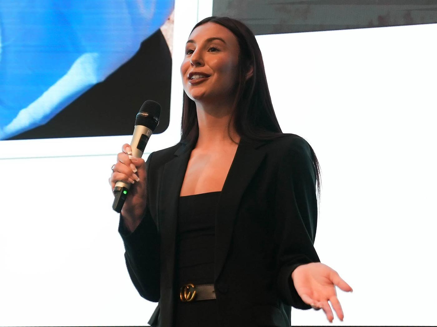 A student confidently explains her ideas during a presentation, highlighting skills gained in ASU's BA in Science Communication program.