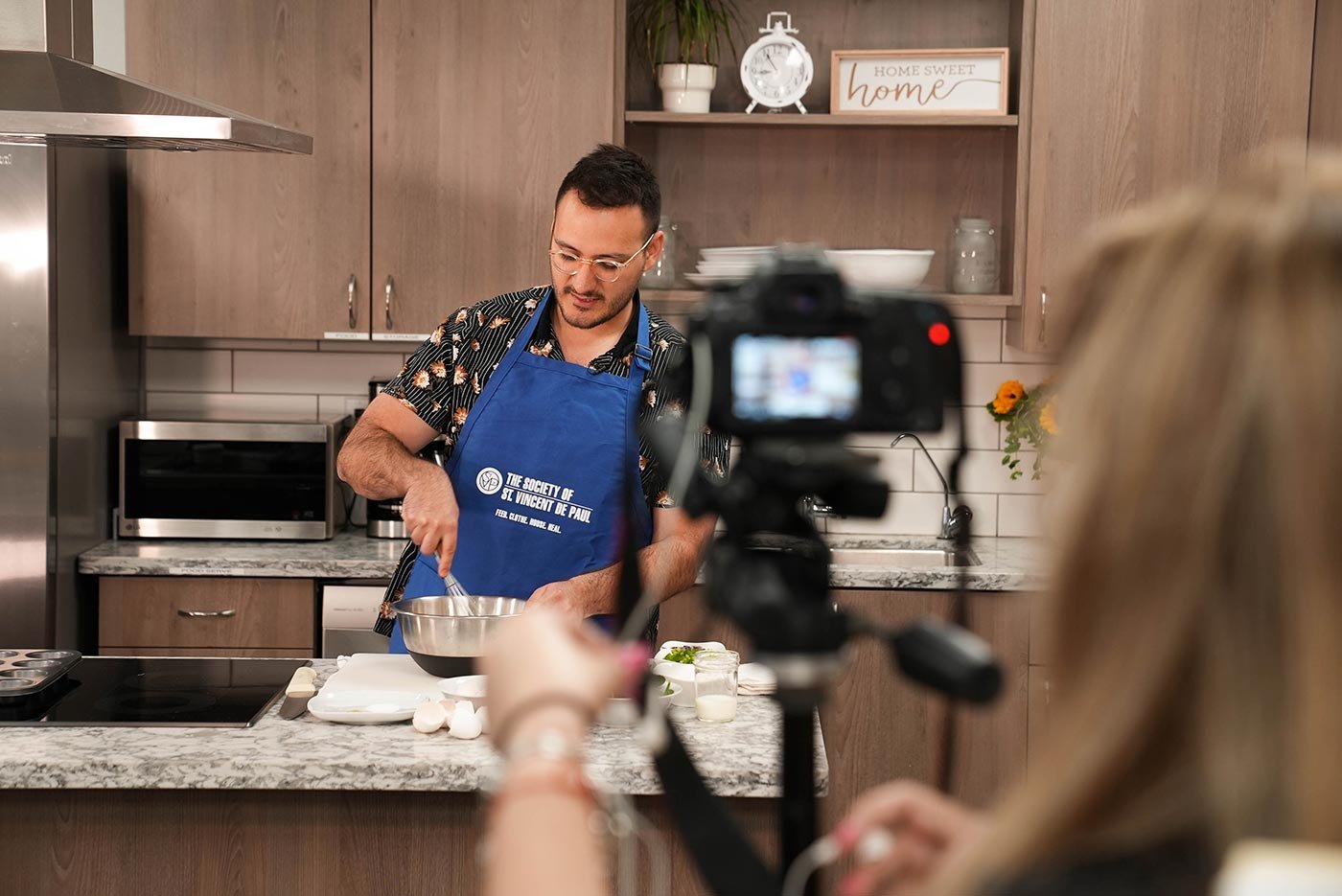 Students film a hands-on cooking demonstration, showcasing practical skills in ASU's MA in Strategic Communication (Health) program.