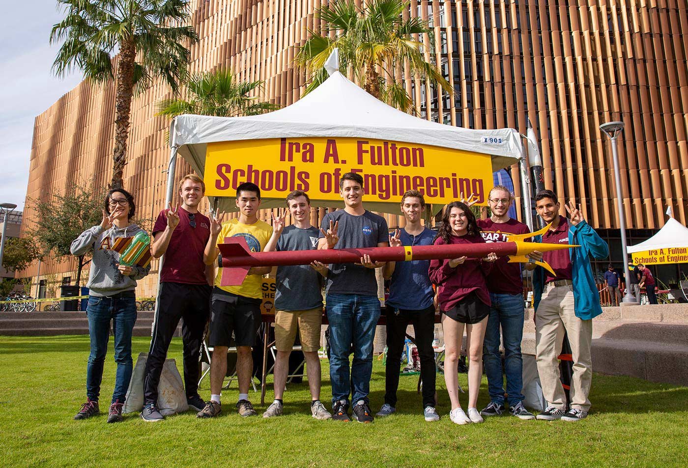 Students showcase a model rocket at the Ira A. Fulton Schools, highlighting hands-on learning in ASU's Aerospace Engineering (Astronautics) program.