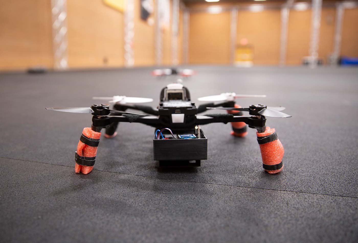 A drone ready for testing in a spacious indoor space, showcasing practical applications in ASU's Aerospace Engineering degree.