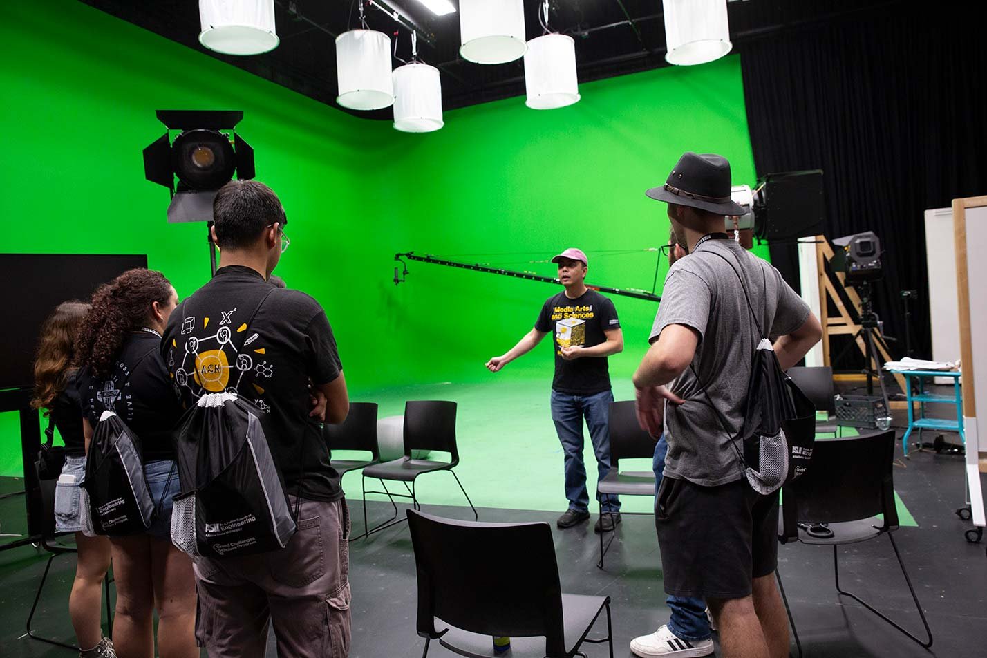 Students tour a green screen production studio, exploring creative technology in ASU's Computer Science (Media Arts and Sciences) degree.