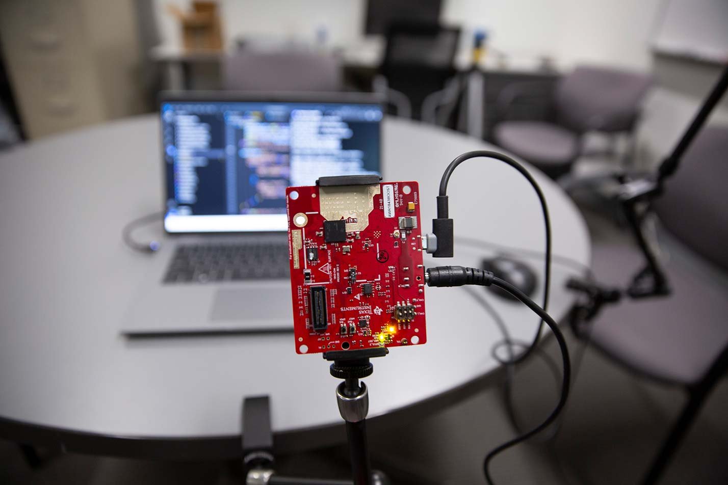 An electronics board linked to a computer demonstrates experimentation in ASU's Electrical Engineering (Media Arts and Sciences), MS degree.