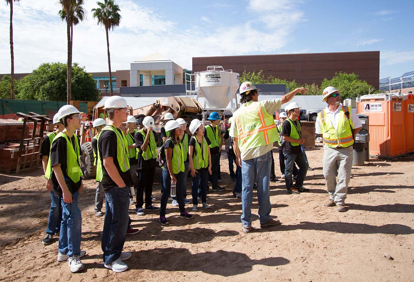 Students tour an active construction site, gaining field experience in ASU's Construction Management, PhD degree.