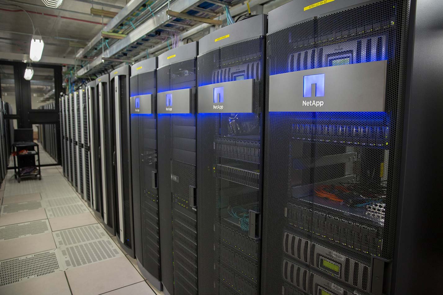 Data servers line a server room, illustrating infrastructure for ASU's Foundations of Computer Science and Artificial Intelligence program.
