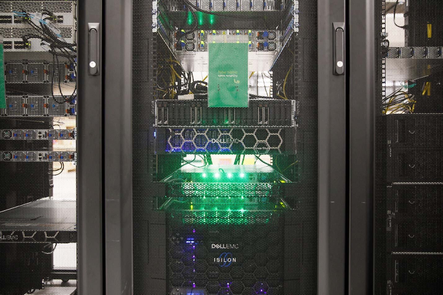 Glowing LED lights on server racks illustrate the infrastructure powering ASU's Computer Science (Big Data Systems) degree.