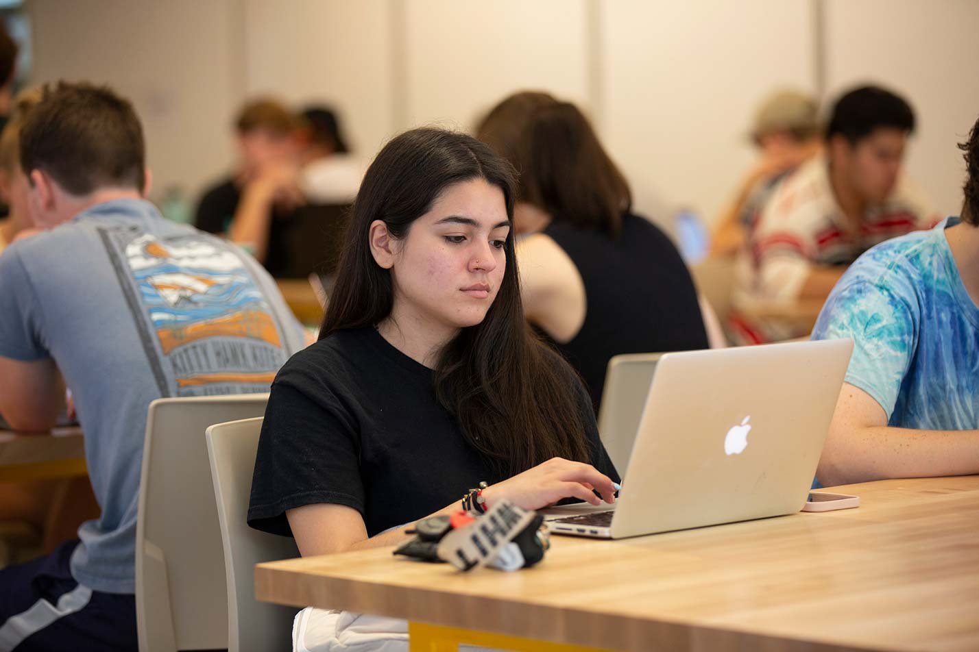 A student works on a laptop in a study space in ASU's Data Science, Analytics and Engineering (Human-Centered Applications), MS degree.