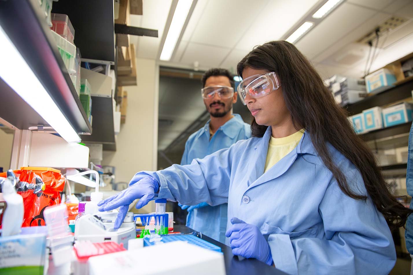 A researcher conducts laboratory experiments, reflecting data-driven innovation in ASU's Human Systems Engineering (Health Systems), MS program.