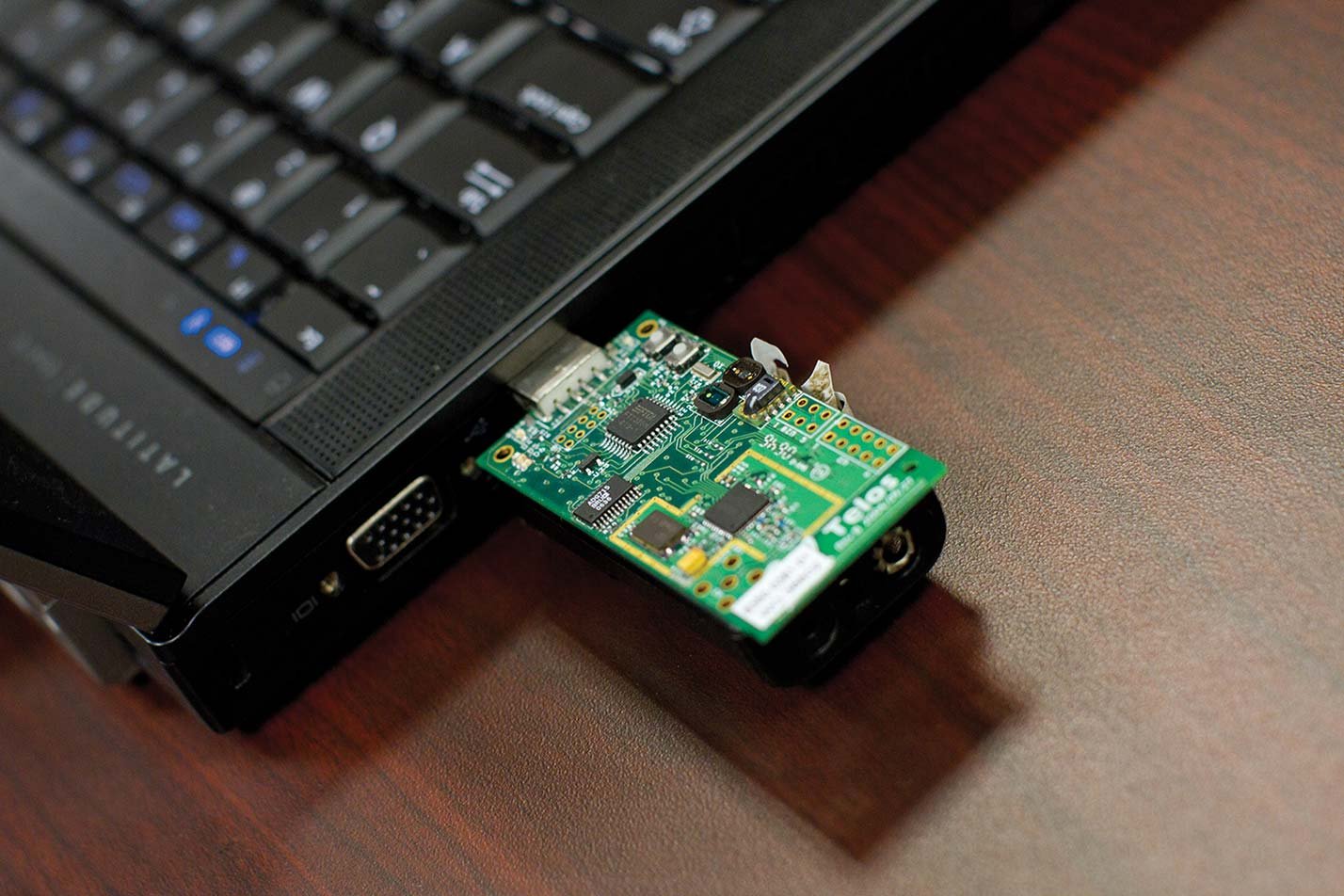 A microcontroller connected to a computer demonstrates embedded technology in ASU's Human Systems Engineering (Intelligent Systems), MS program.