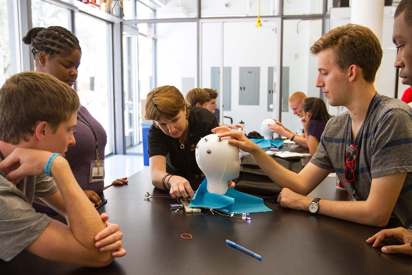 Students collaborate on a medical device prototype, demonstrating practical innovation in ASU's Medical Engineering, MS program.