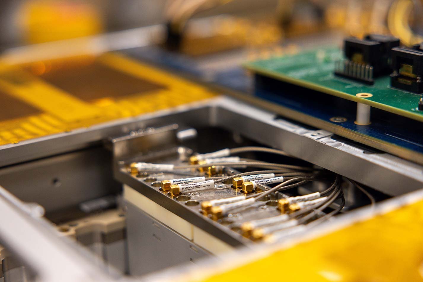 A semiconductor device undergoes precision testing, showcasing advanced manufacturing in ASU's Management of Technology, MS program.