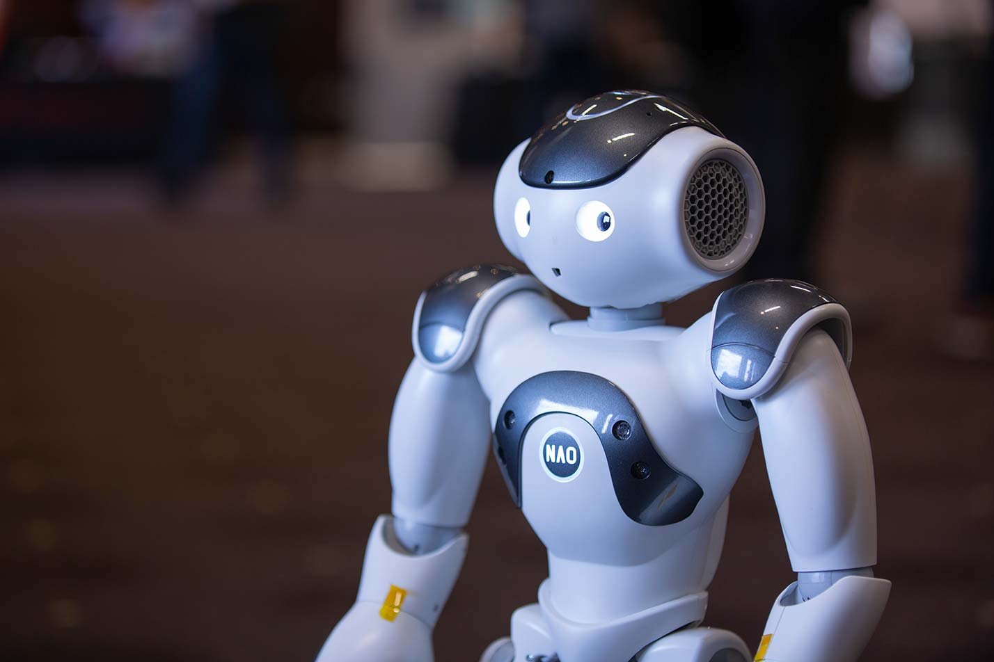 A robot demonstrates interactive capabilities, showcasing hands-on learning in ASU's Physical Artificial Intelligence Engineering program.