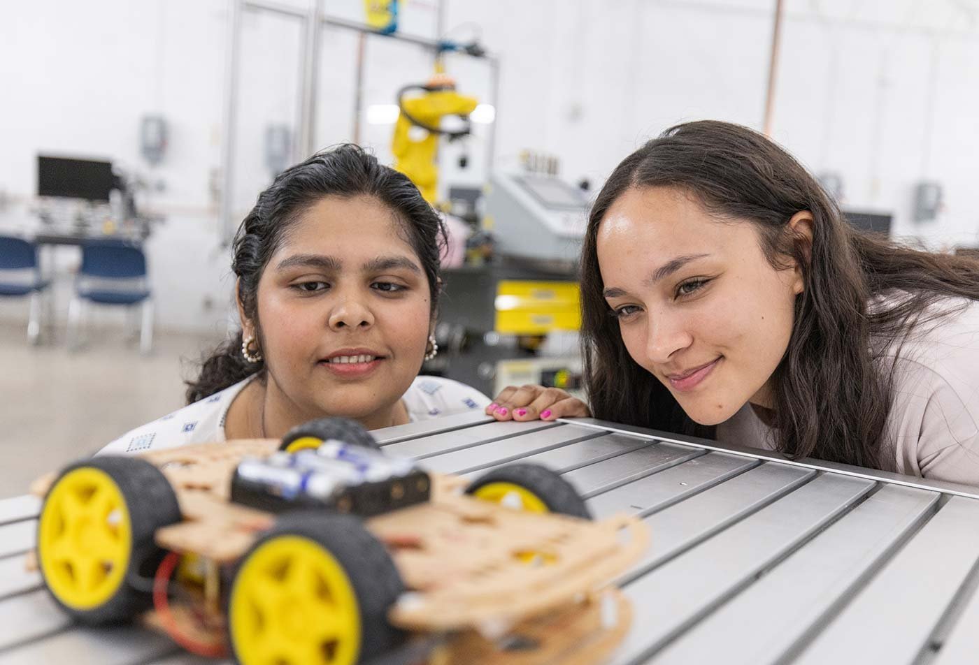 Students evaluate a robotic vehicle prototype in ASU's Robotics and Autonomous Systems (Mechanical and Aerospace Engineering), MS program.