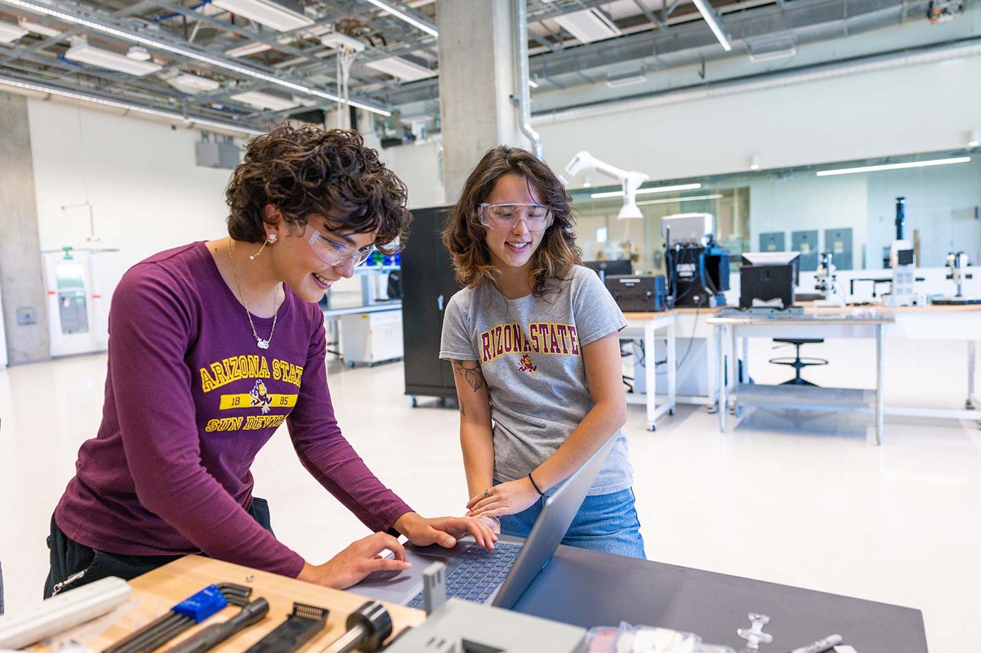 Students collaborate on robotic systems in a lab in ASU's Robotics and Autonomous Systems (Mechatronics and Automation), PhD program.