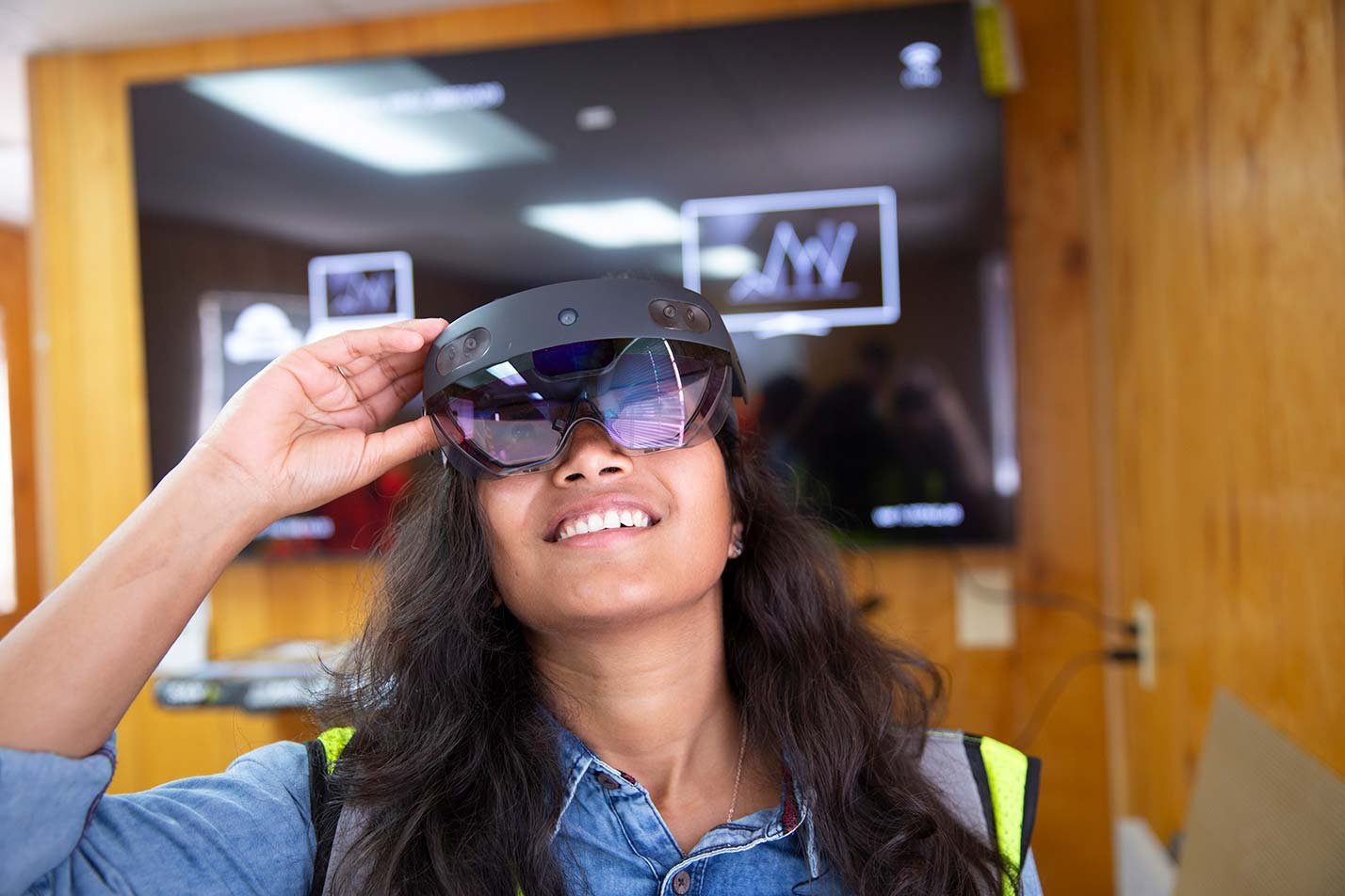 A student explores an augmented reality interface, highlighting immersive design in ASU's User Experience, MS program.