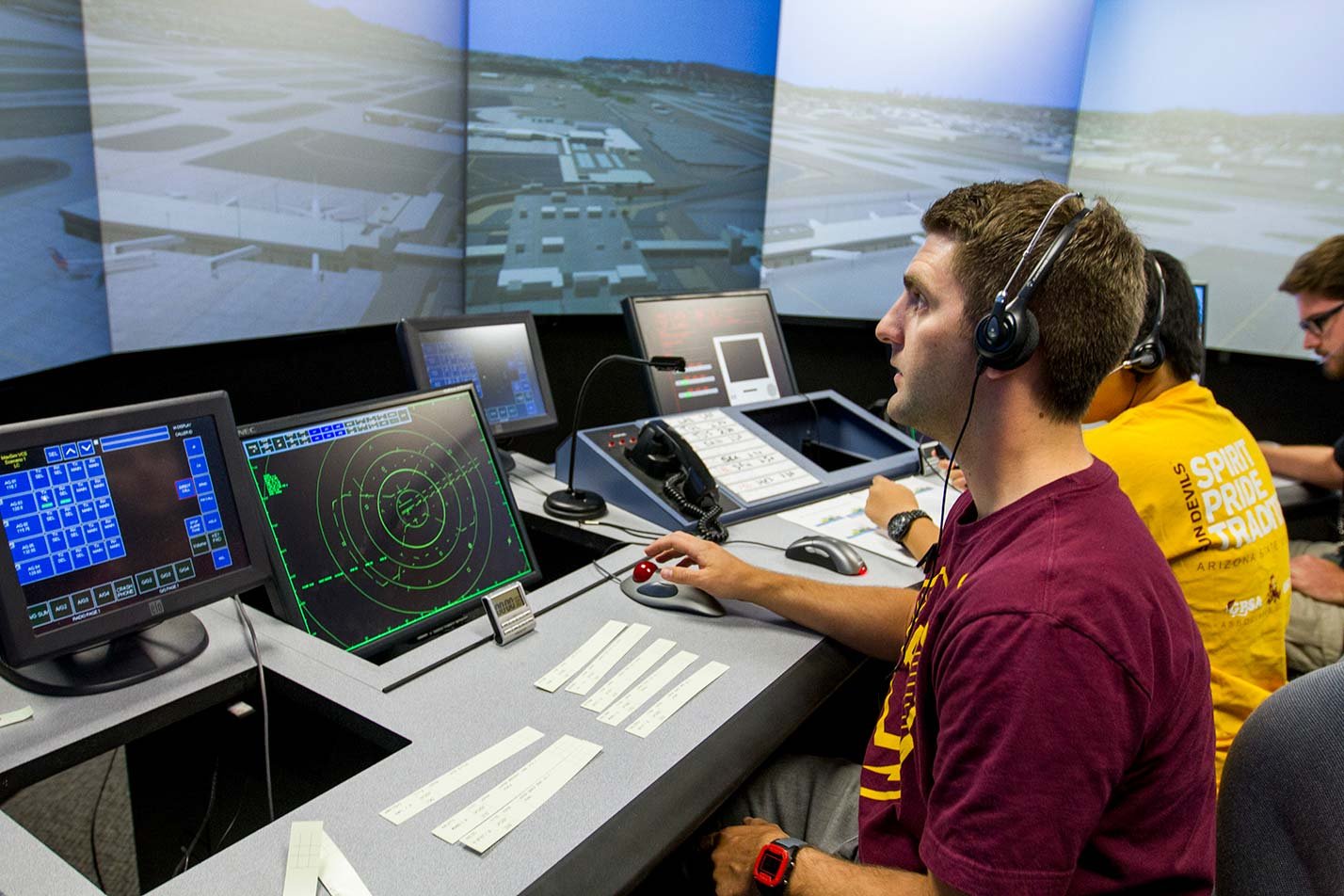 Air traffic controllers engaged in a simulation, exemplifying practical training in ASU's Aeronautical Management Technology (Unmanned Aerial Systems) degree.