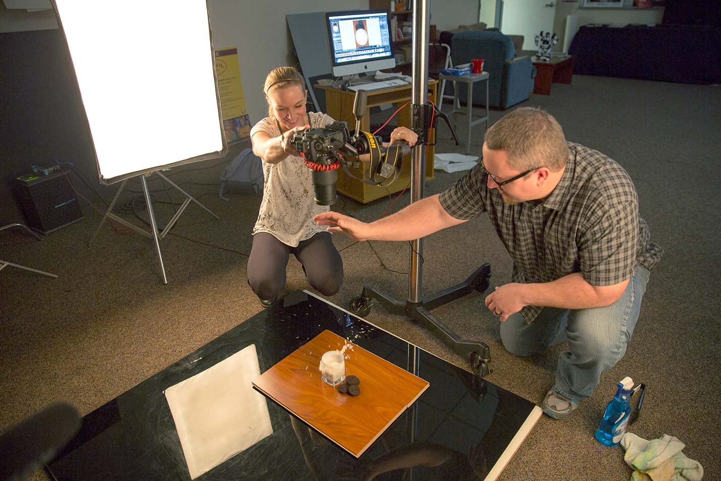 Students using photography equipment, representing hands-on experiences in ASU's Applied Science (Graphic Information Technology) degree.