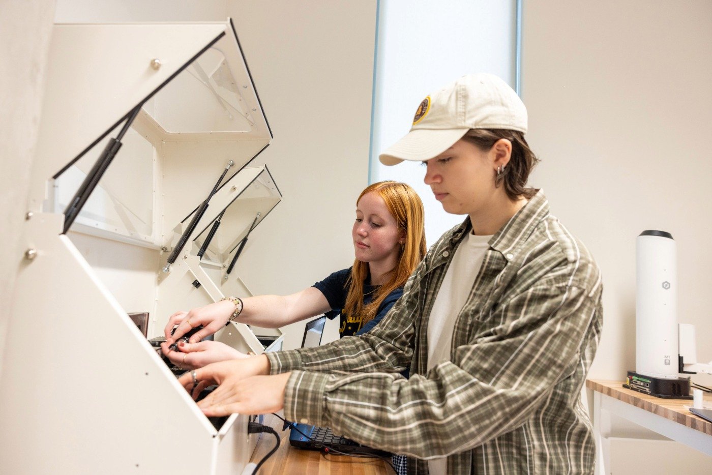 Researchers develop advanced materials in a laboratory, highlighting hands-on experimentation in ASU's Manufacturing Engineering, MS program.