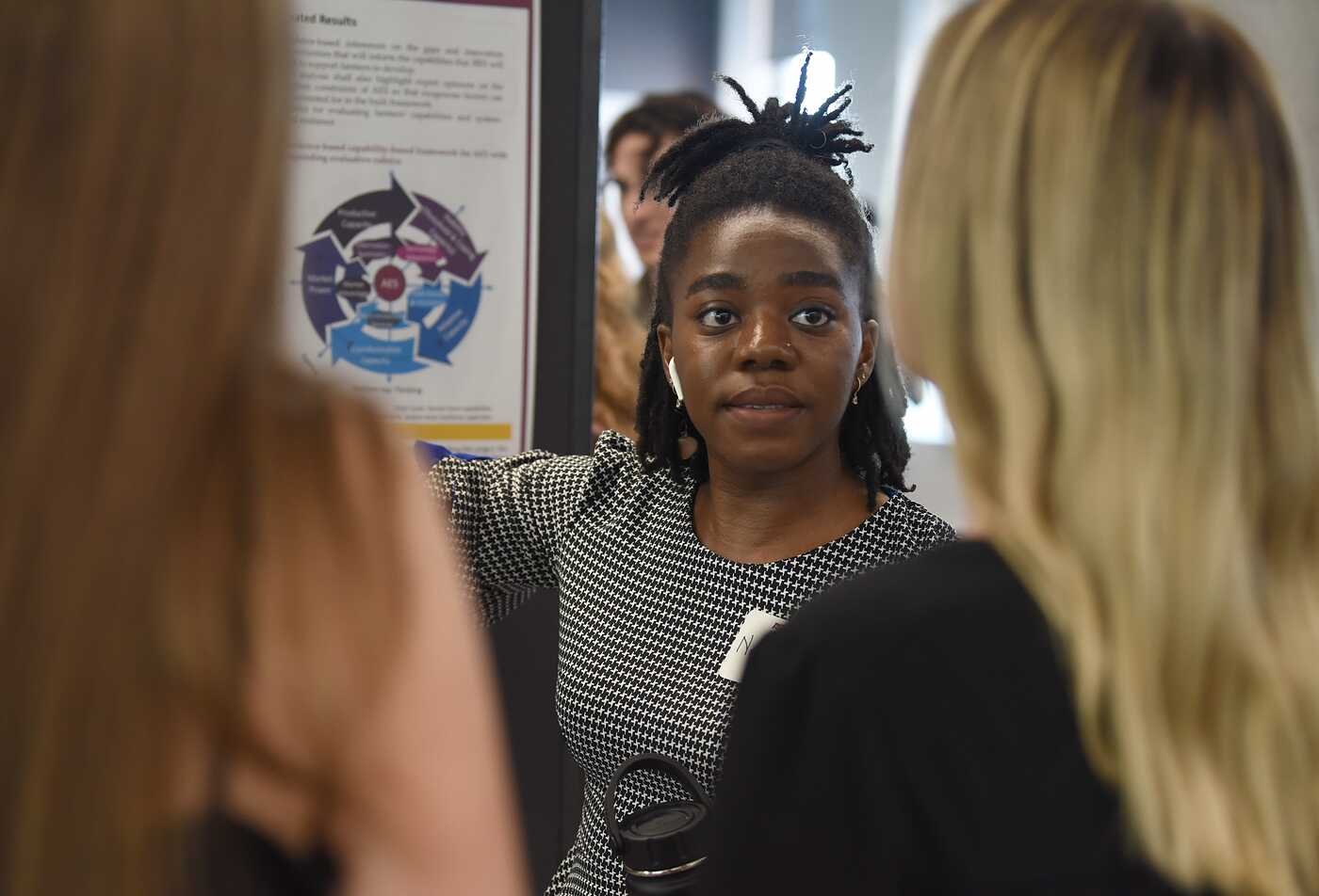 ASU Rob Walton College of Global Futures student presents her research around innovation and global development at a poster session.
