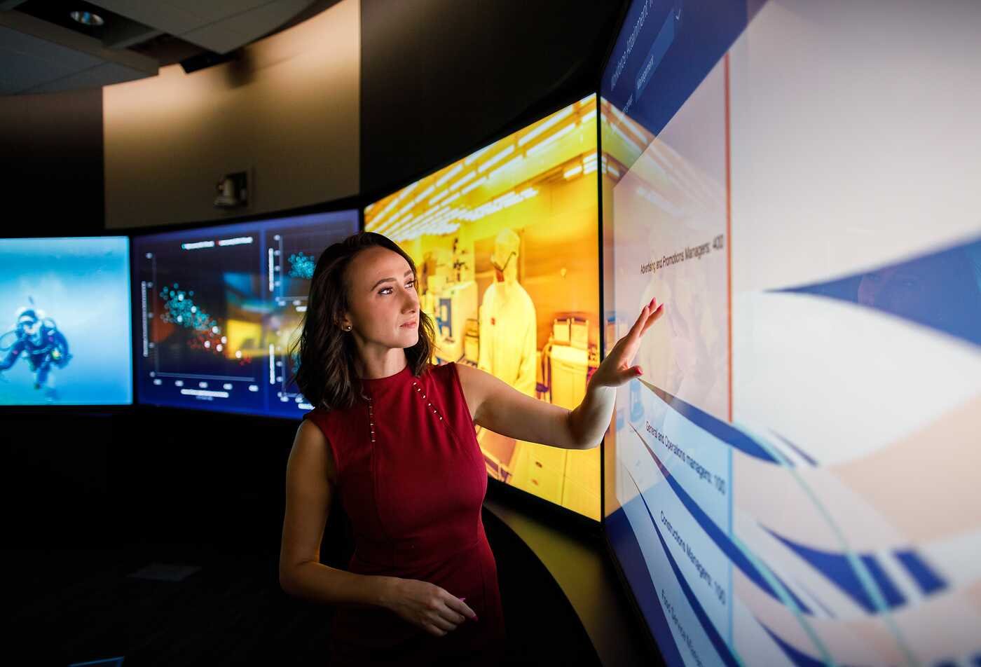 Arizona State University doctoral student engaging with data through the Rob Walton College of Global Futures and the Decision Theater