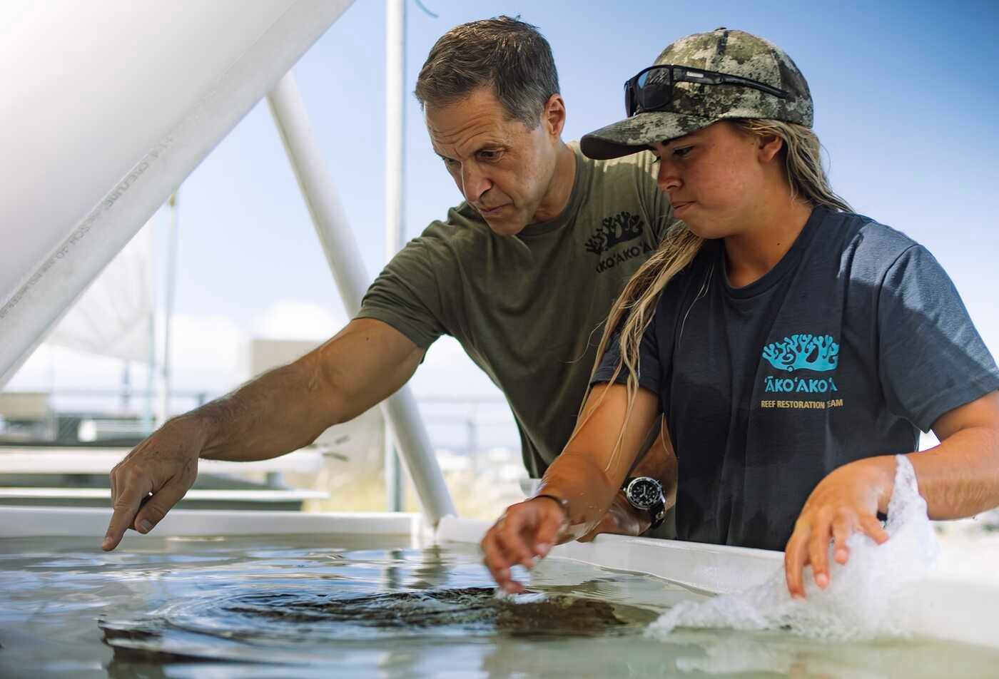 An ASU Local student in Hawai'i researching coral reefs with School of Ocean Futures professor Greg Asner.