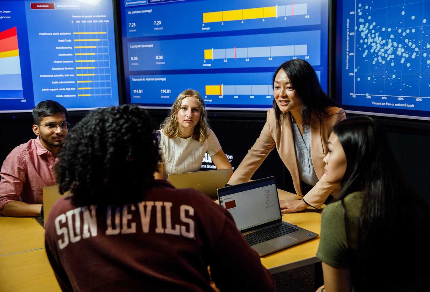 Complexity Science students from ASU's Rob Walton College of Global Futures listening to a faculty member from the Decision Theater