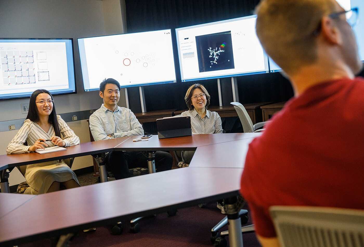 ASU students discuss the different uses of applied mathematics at round table in the PhD in Applied Mathematics for the Life and Social Sciences.
