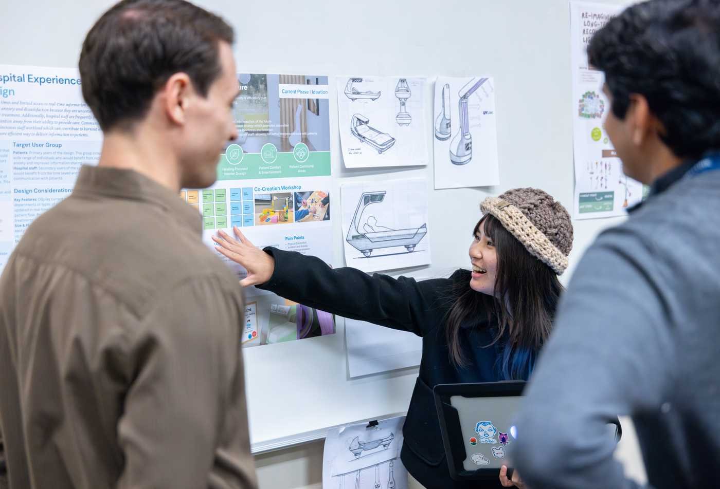 Students review designs for hospital experiences, showcasing the field explored in the Healthcare and Healing Environments, MSD.