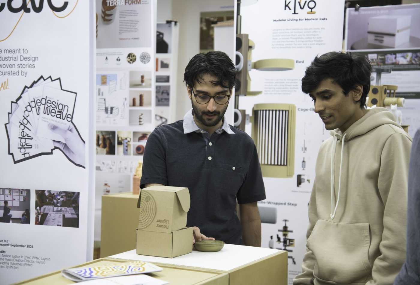 Industrial design students review projects created by classmates, showcasing hands-on learning in the BSD in Industrial Design.