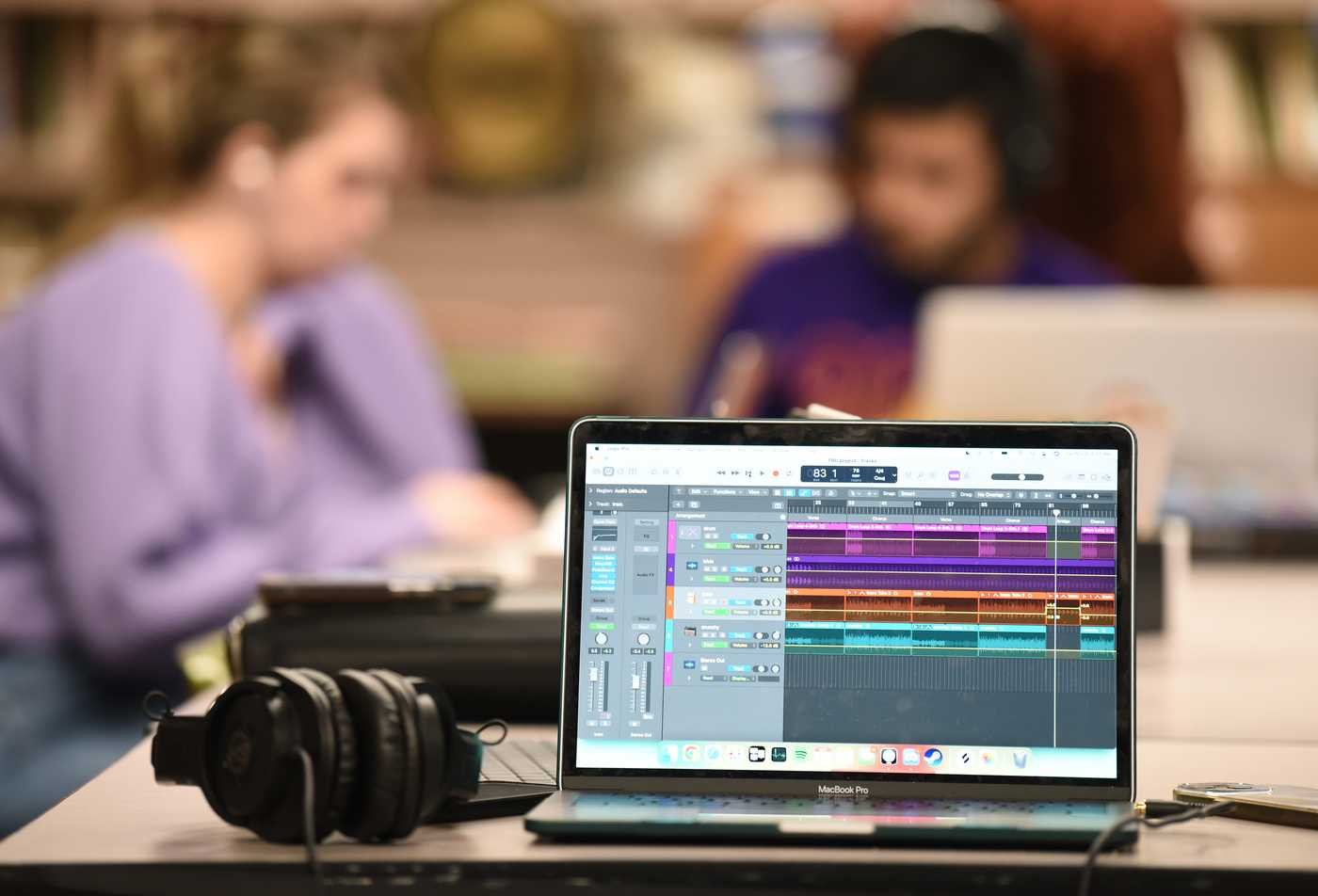 A laptop displays multiple sound samples, symbolizing the field of the Music Composition, DMA.