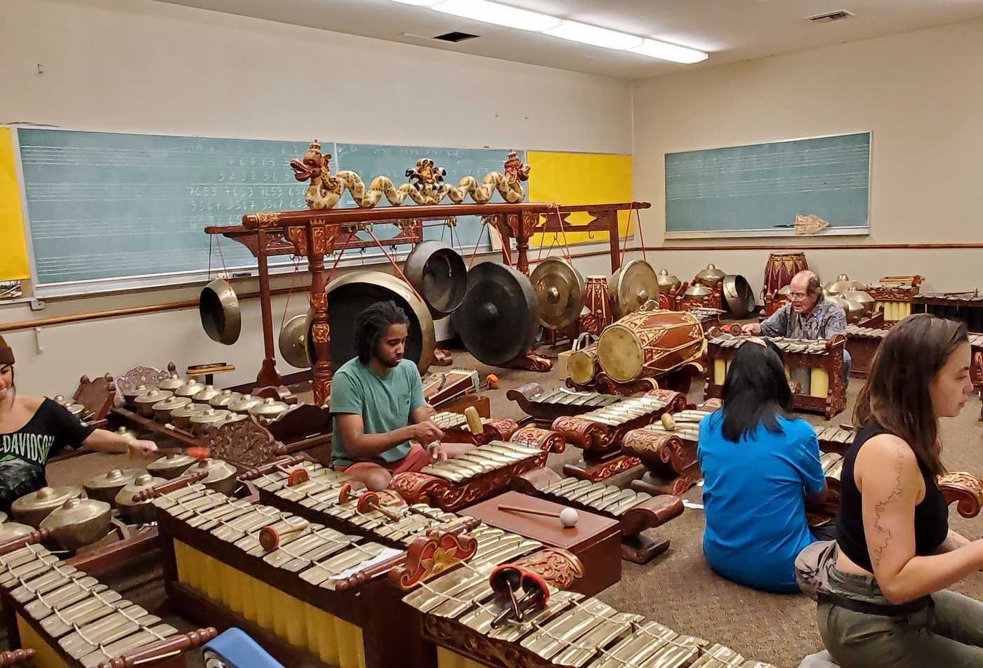 Students explore a room full of instruments from Asia, showcasing the field explored in the Music (Ethnomusicology), MA.