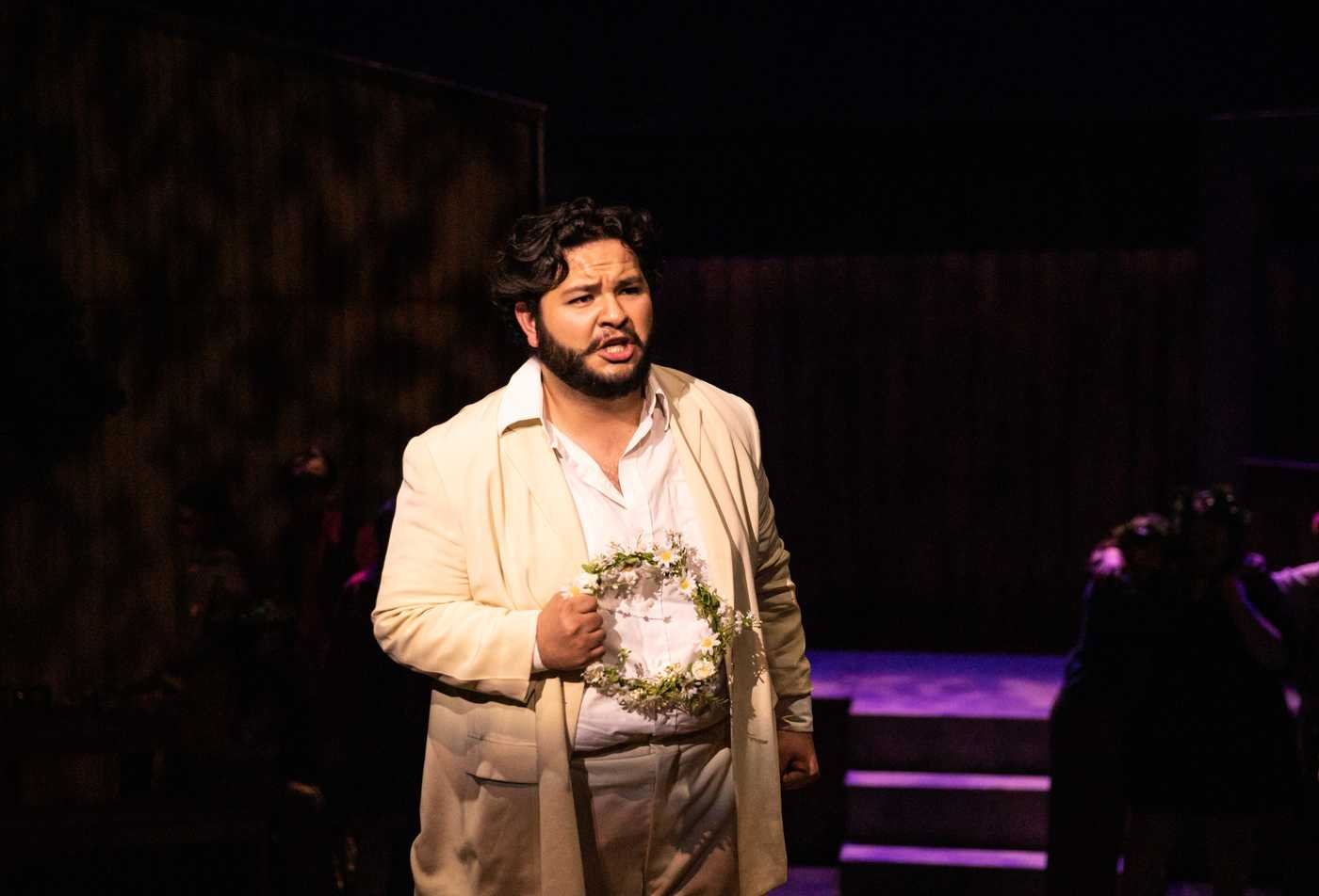 A vocalist sings in a professional performance, showcasing hands-on learning in the Performance (Voice, Music Theatre, Opera), MM.