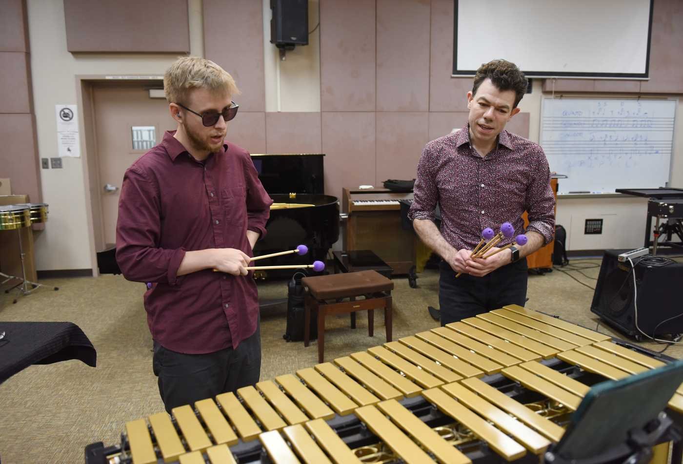 Students play a xylophone in a classroom, showcasing hands-on learning in the Performance (Performance Pedagogy), MM.