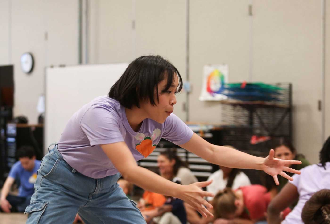 Theatre for Youth and Community students perform for youth in a classroom, showcasing hands-on learning in the MFA.
