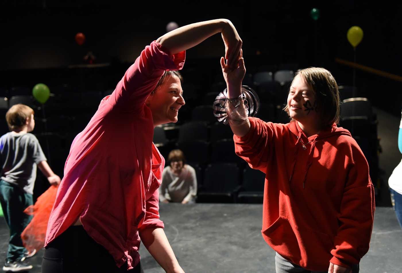 ASU students dance with youth as part of the Theatre (Theatre for Youth and Community), PhD.