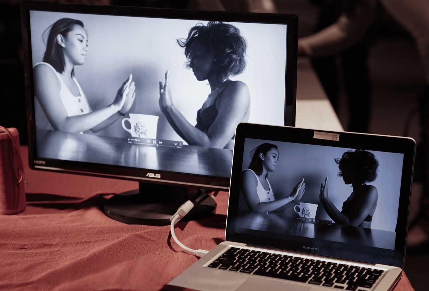 A computer displays a black and white student film, showcasing the field explored in the BA in Media Arts and Sciences (Film).