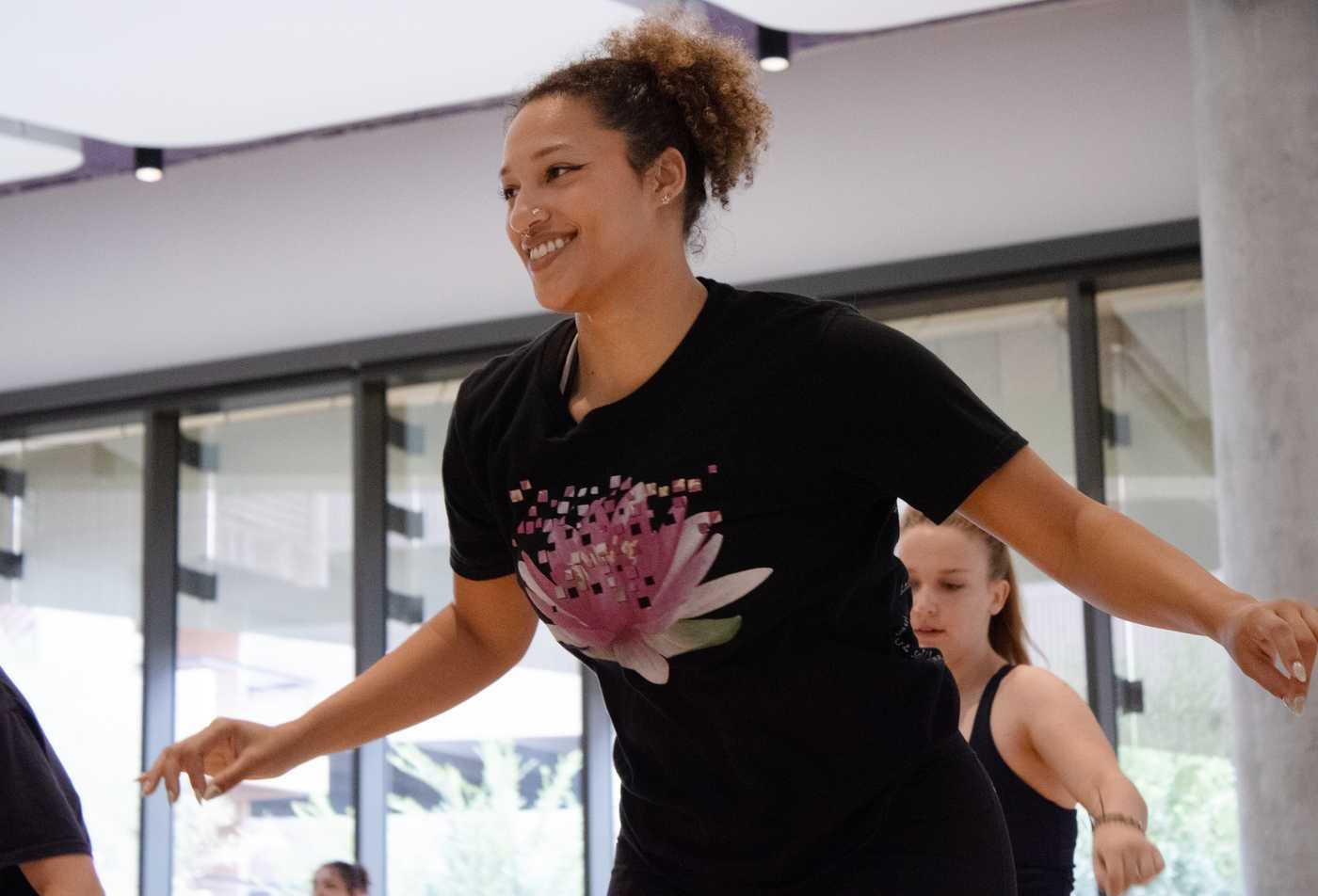 Students dance in a studio, demonstrating hands-on practice in the Dance Teaching Artist Praxis (Graduate Certificate).