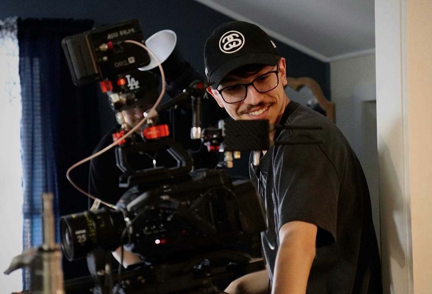 Students film a scene on a professional set, demonstrating the field explored in the BFA in Film and Media Production (Cinematography).