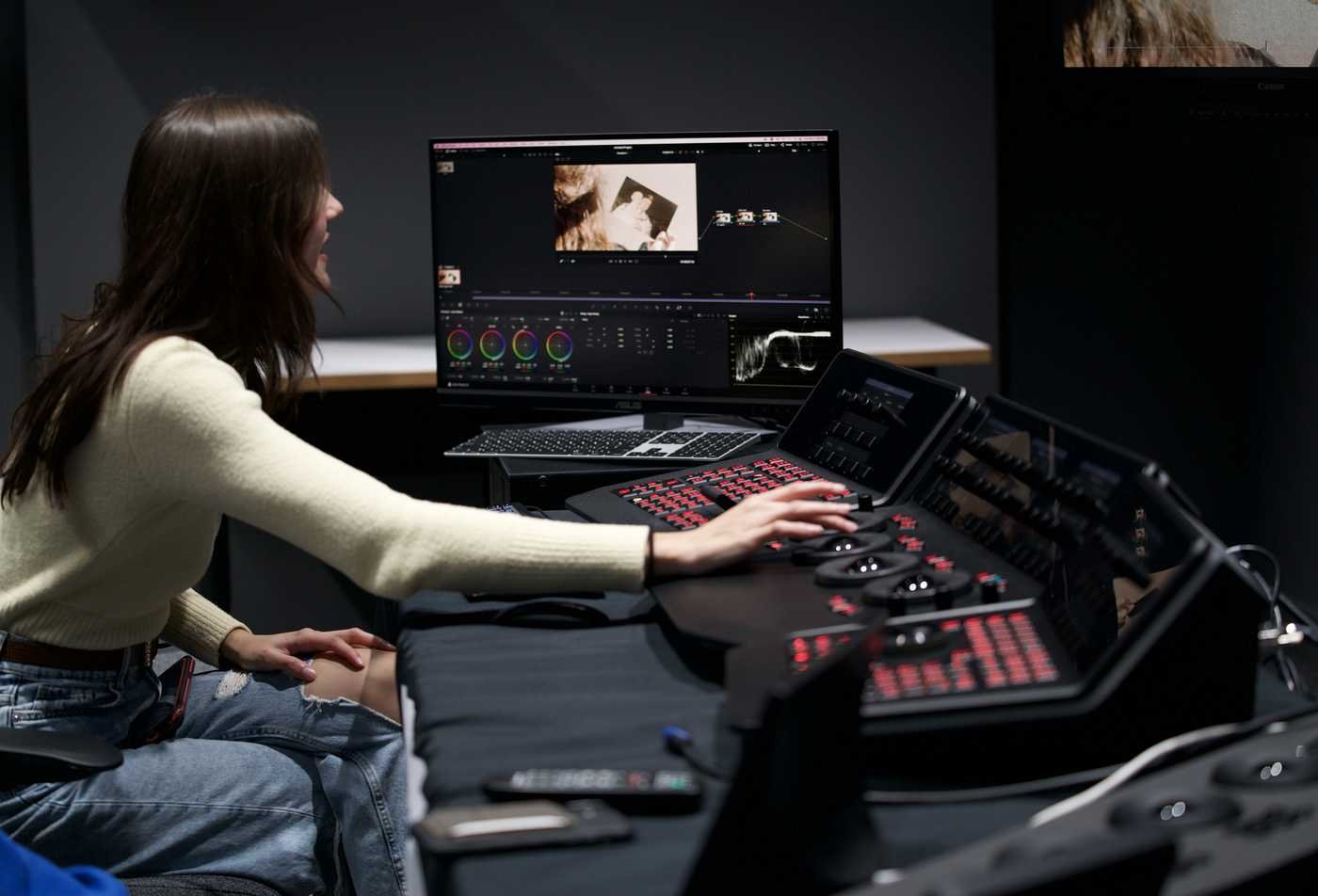 A student corrects coloring ofa video, demonstrating hands-on learning in the BFA in Film and Media Production (Post-Production).