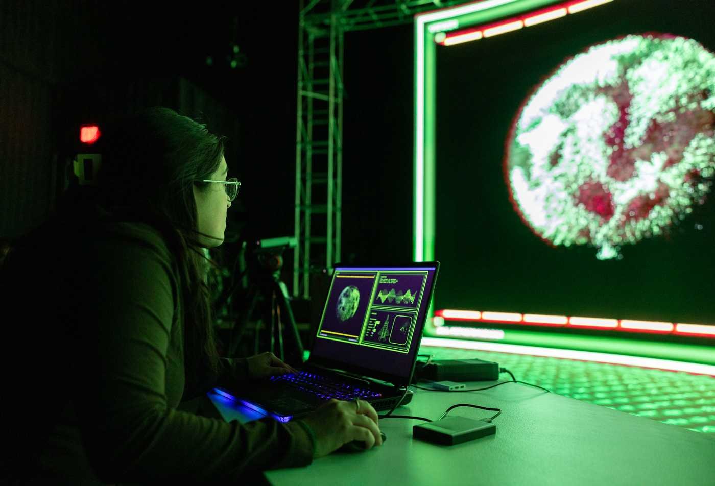 A student creates a visual digital experience, showcasing the field explored in the Immersive Experience Design, MS.