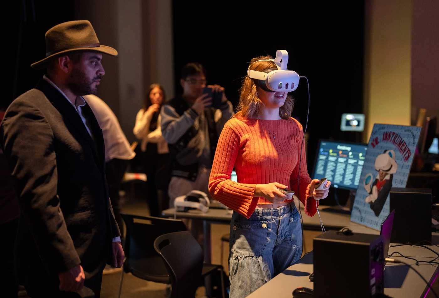 A student tries a VR experience at a showcase, demonstrating the field explored in the BS in Media Arts and Sciences (Games and Interactive Media).