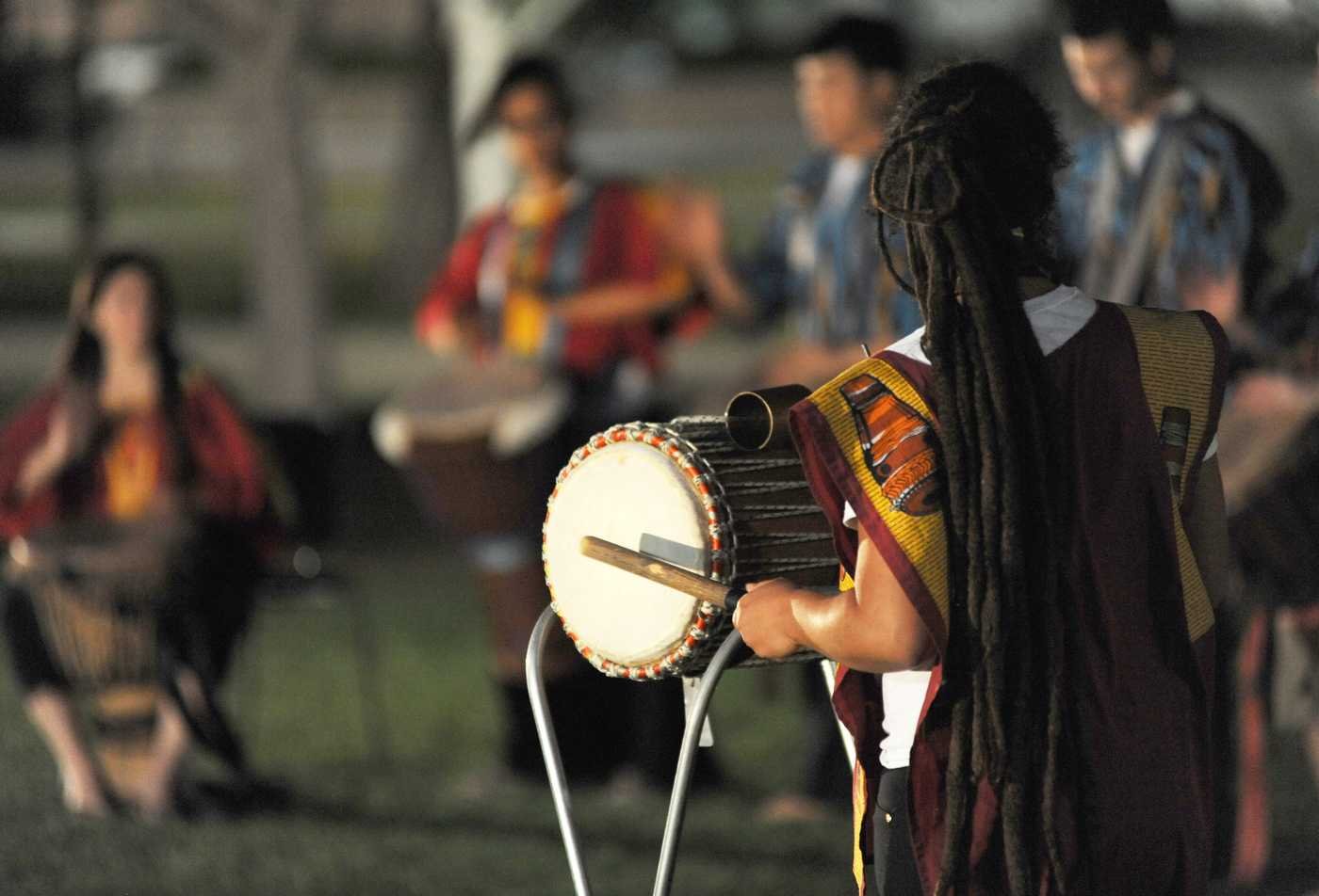 A Native America band drums together, showcasing the field explored in the BA in Music (Music and Culture).