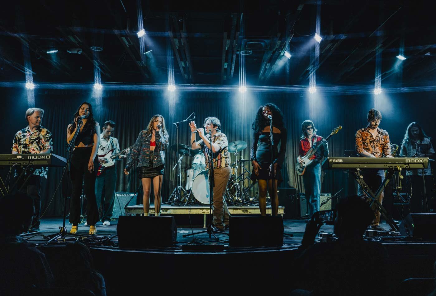 A band performs upon a stage, showcasing the field explored in the BA in Music (Popular Music).