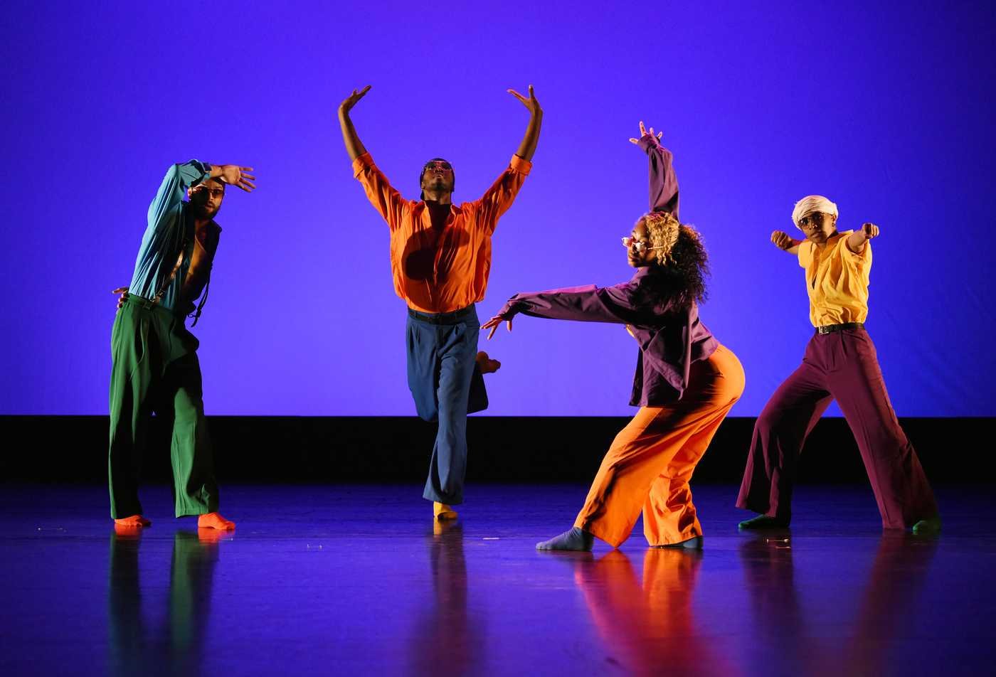 Performers pose on a stage, demonstrating the field explored in the BA in Performance and Movement.