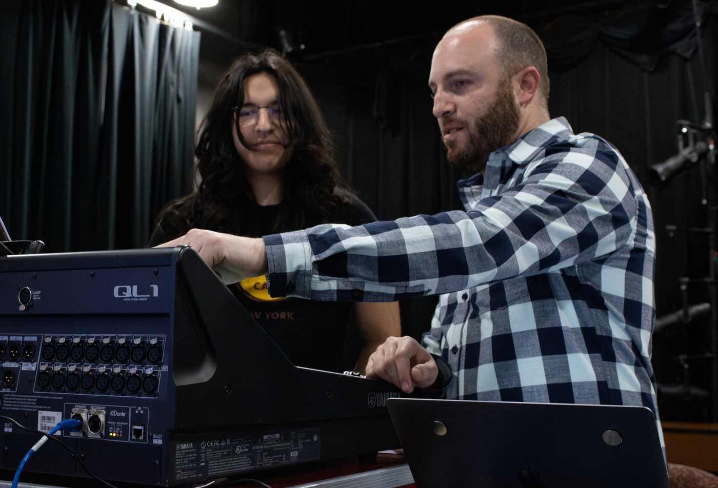 A production crew works on sound design and technology, demonstrating the field explored in the minor in Theatre - Sound Design and Technology.