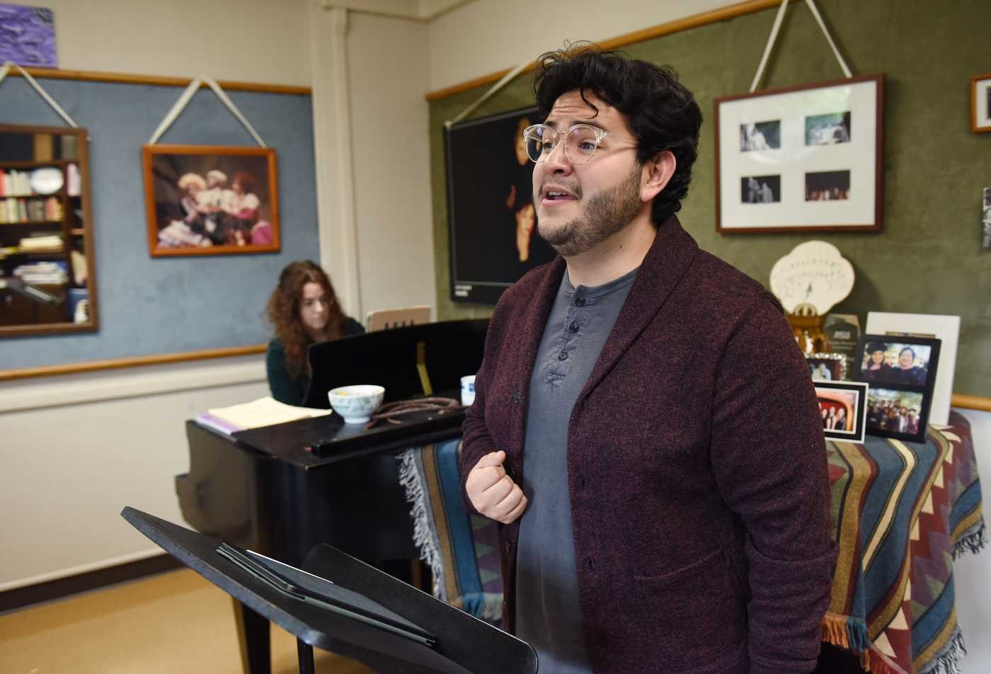 A student sings passionately in a classroom, showcasing hands-on learning in the certificate in Vocal Pedagogy.